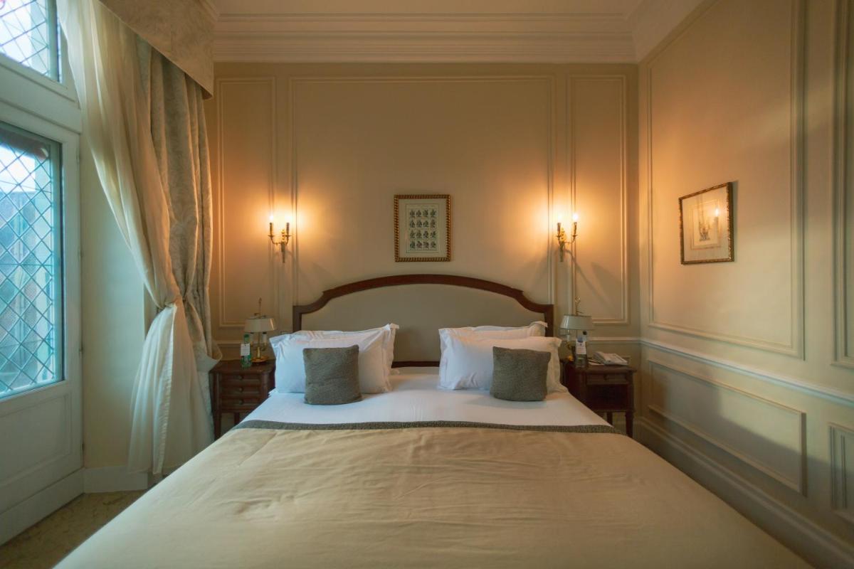 Un ou plusieurs lits dans un hébergement de l'établissement Hotel de la Cité Carcassonne - MGallery Collection
