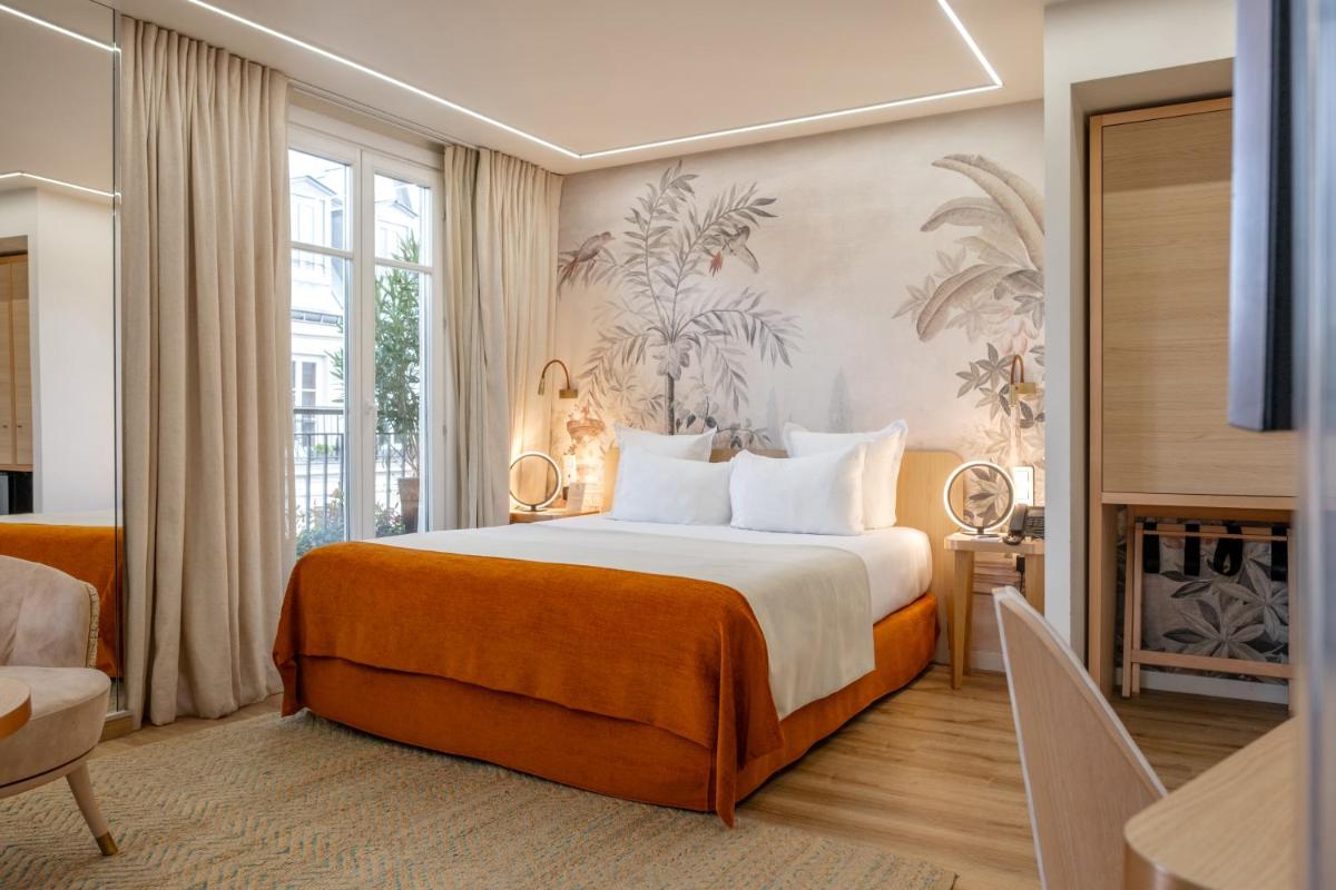 Un ou plusieurs lits dans un hébergement de l'établissement Grand Hotel Saint Michel