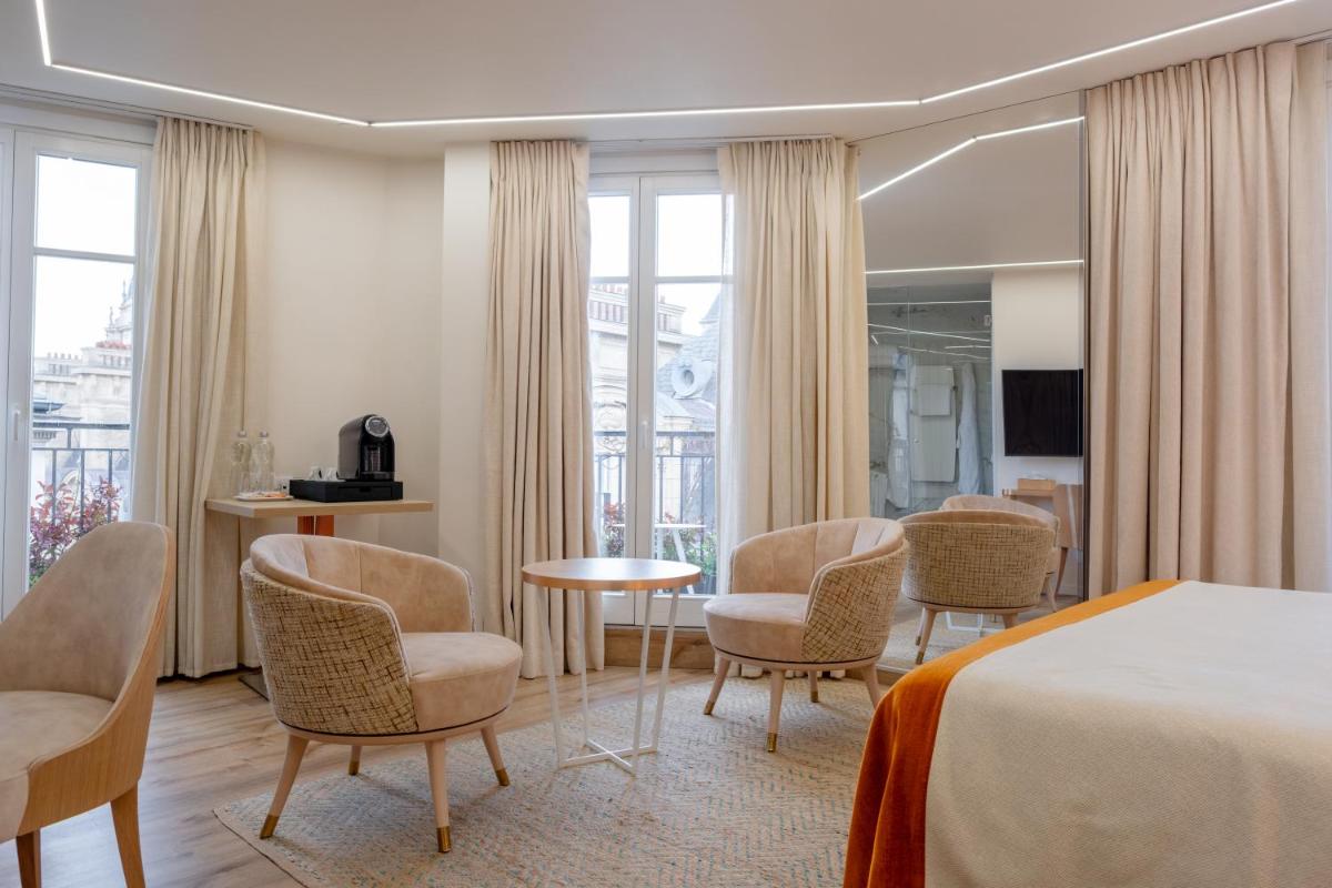 Télévision ou salle de divertissement dans l'établissement Grand Hotel Saint Michel