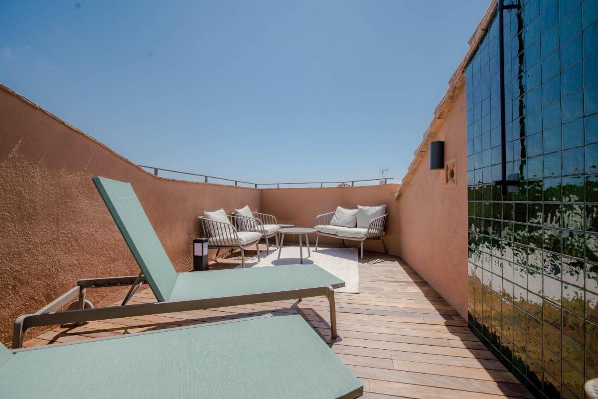 Un balcón o terraza de Gran Claustre Boutique Hotel