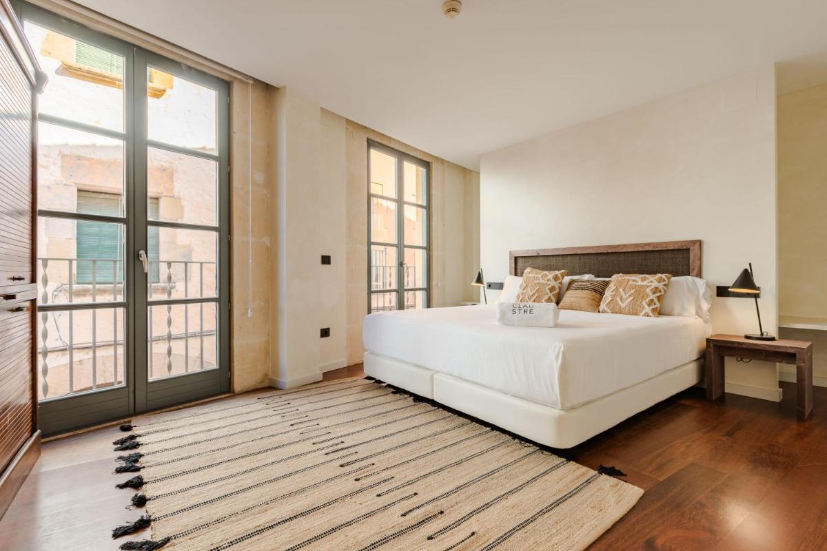 Cama o camas de una habitación en Gran Claustre Boutique Hotel