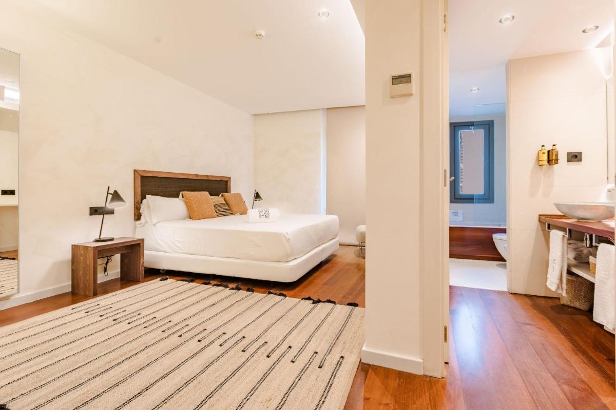 Cama o camas de una habitación en Gran Claustre Boutique Hotel