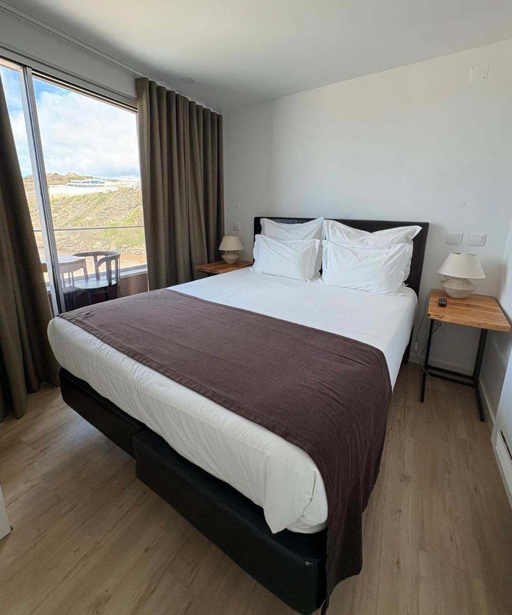 Uma cama ou camas num quarto em Promar - Eco Beach & Spa Hotel