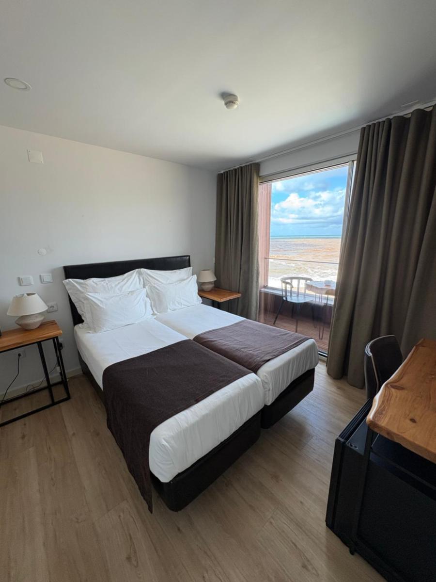 Uma cama ou camas num quarto em Promar - Eco Beach & Spa Hotel