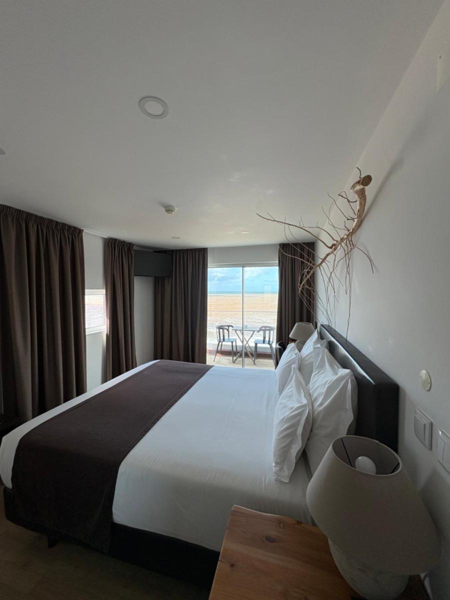 Uma cama ou camas num quarto em Promar - Eco Beach & Spa Hotel