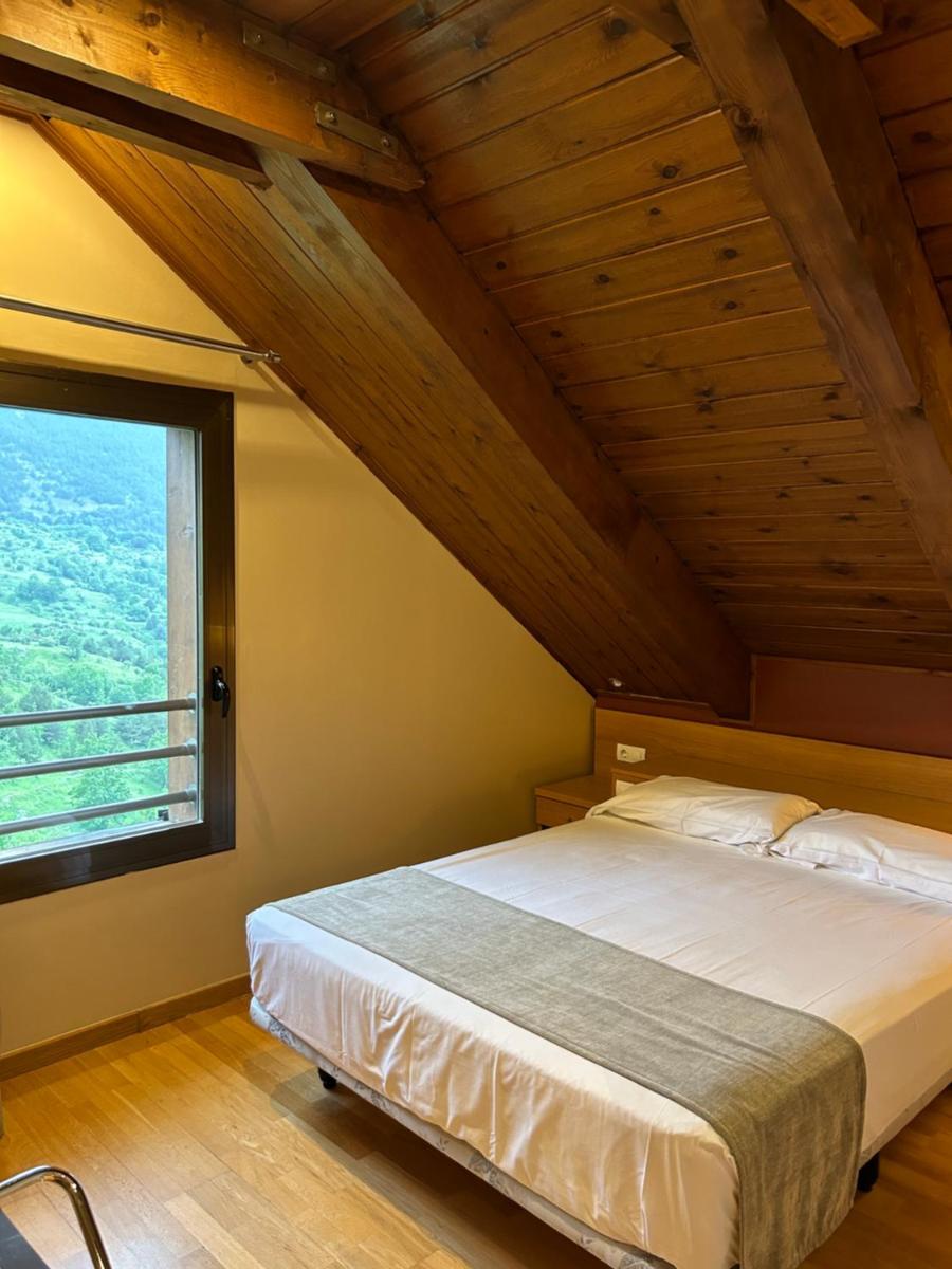 Cama o camas de una habitación en Aparthotel Siente Boí & SPA
