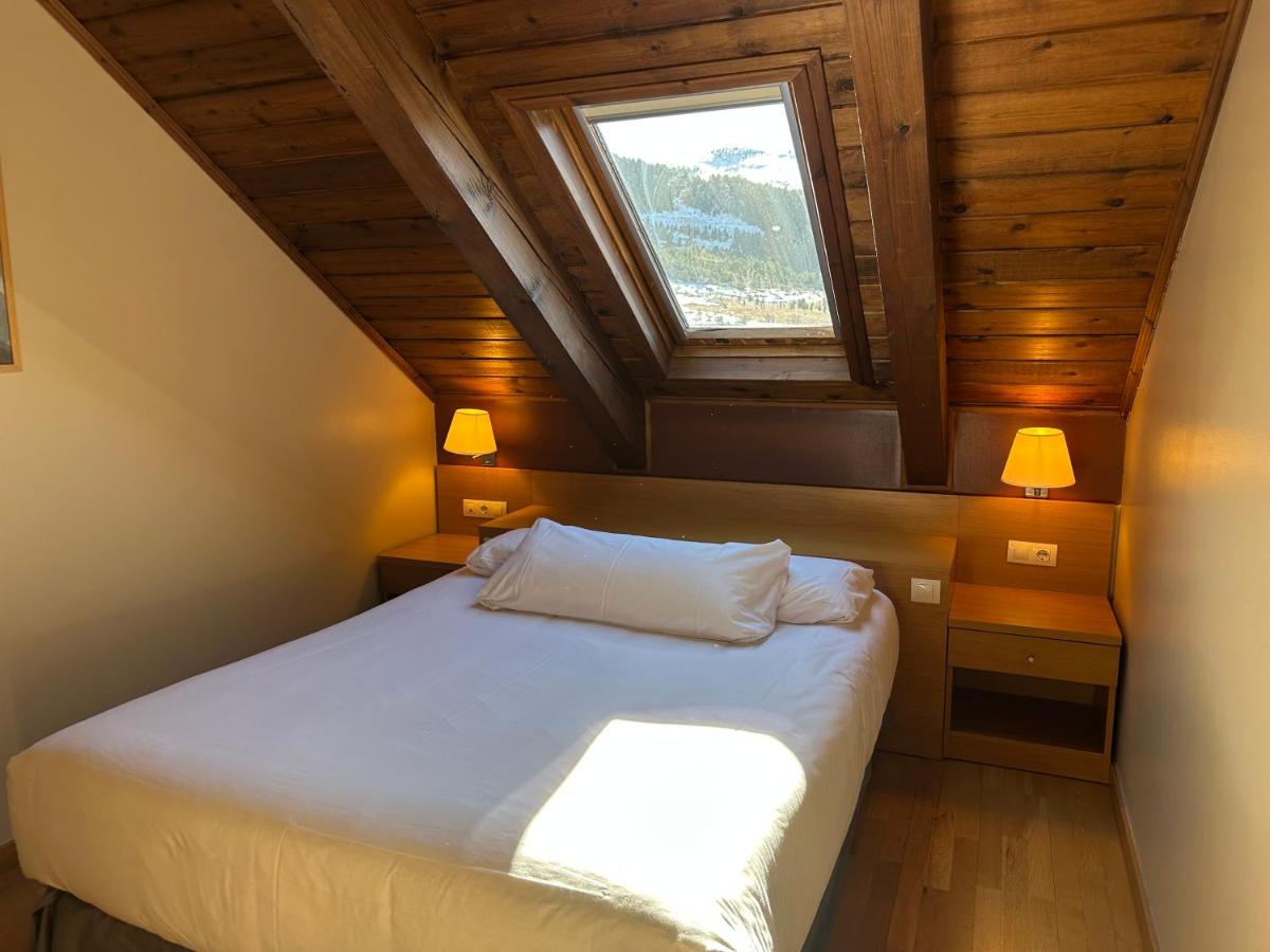 Cama o camas de una habitación en Aparthotel Siente Boí & SPA