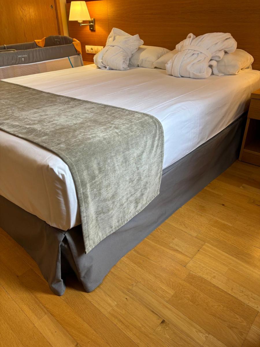 Cama o camas de una habitación en Aparthotel Siente Boí & SPA