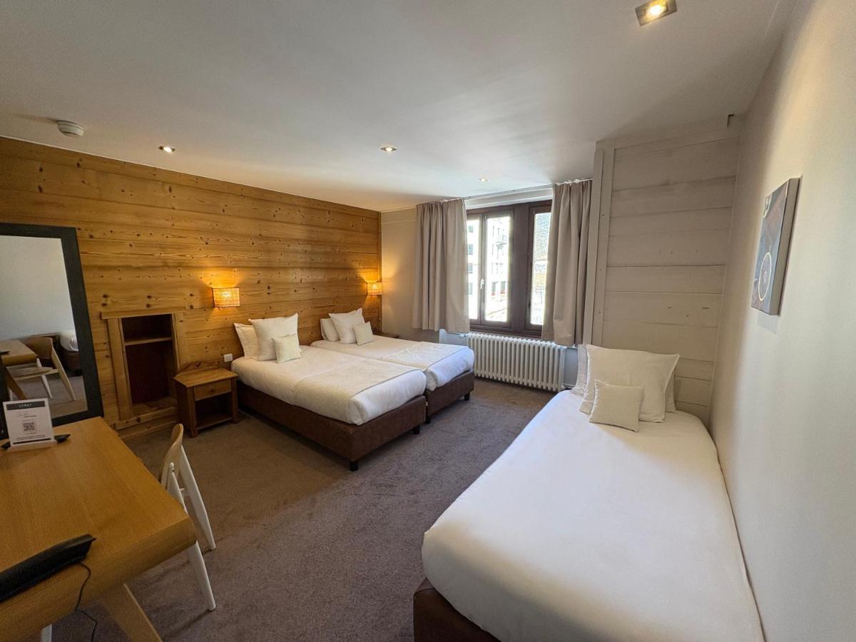 Un ou plusieurs lits dans un hébergement de l'établissement Hôtel Lyret