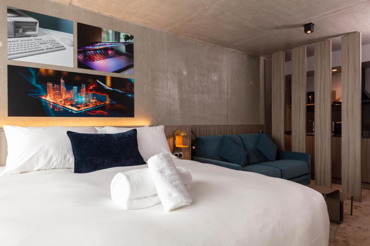 Un ou plusieurs lits dans un hébergement de l'établissement Ki Space Hotel & Spa - near Disneyland Paris