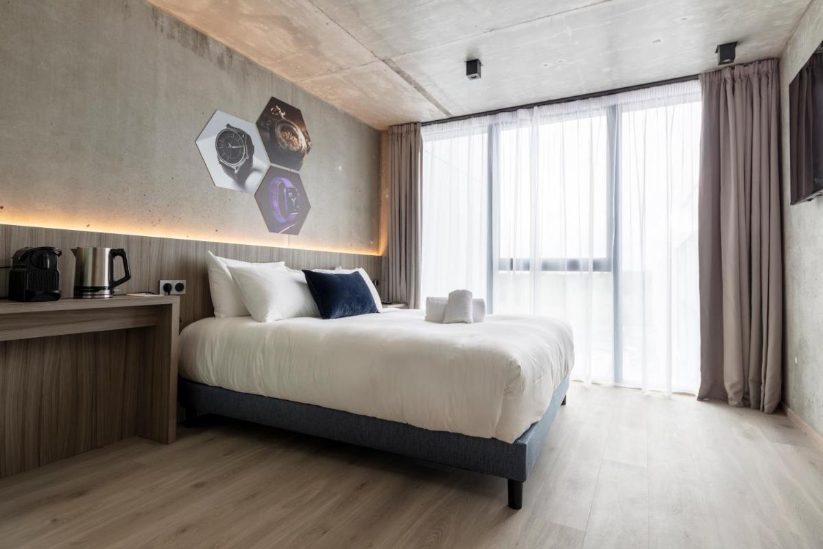 Un ou plusieurs lits dans un hébergement de l'établissement Ki Space Hotel & Spa - near Disneyland Paris