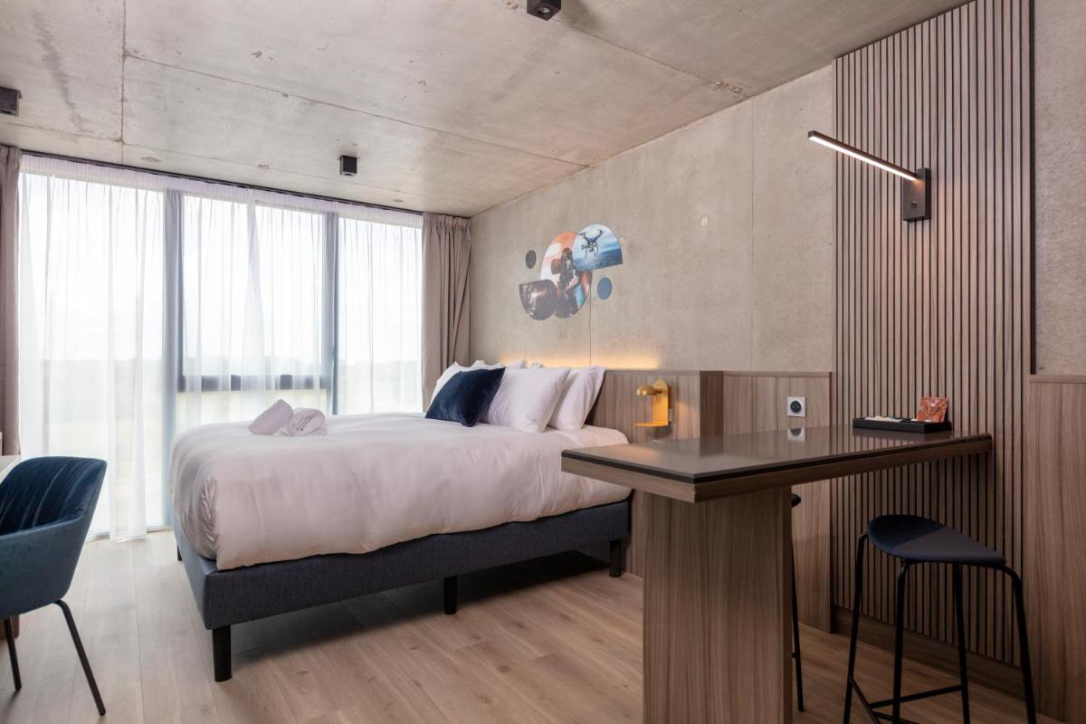 Un ou plusieurs lits dans un hébergement de l'établissement Ki Space Hotel & Spa - near Disneyland Paris