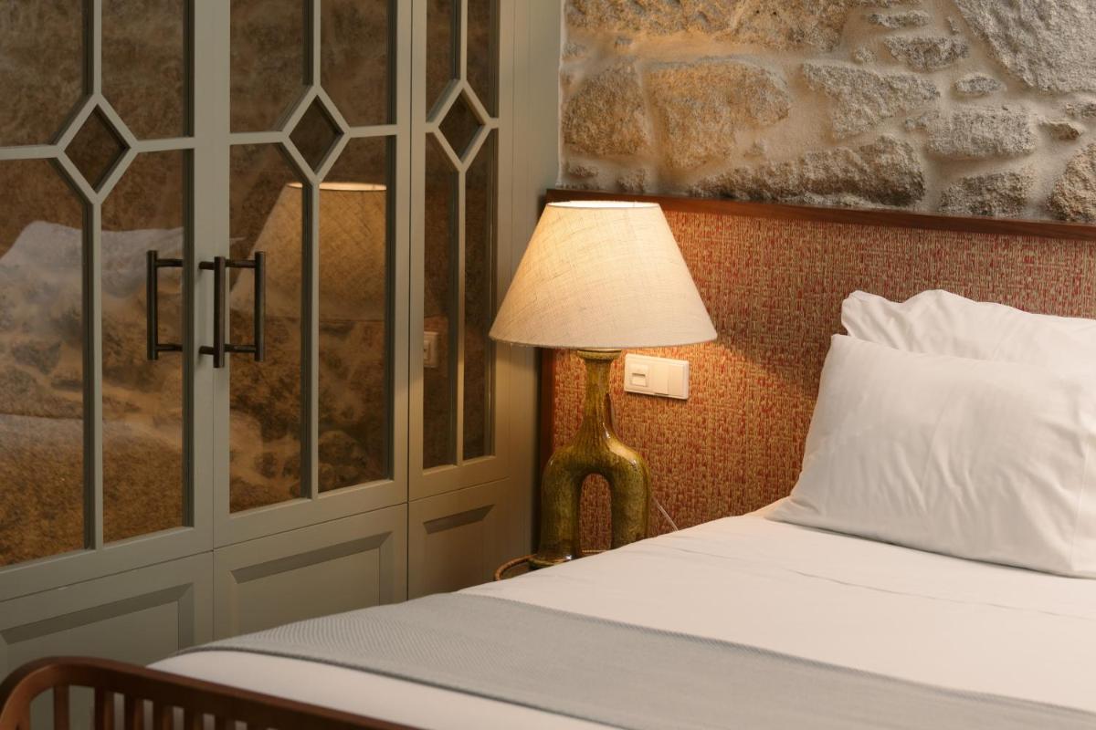 Uma cama ou camas num quarto em Torel Saboaria