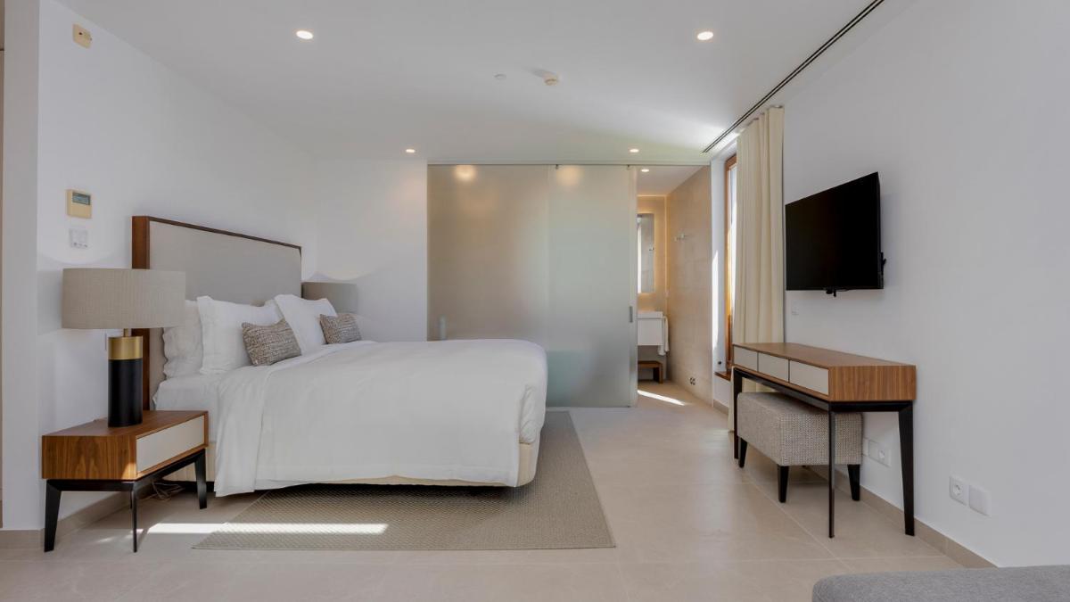 Uma cama ou camas num quarto em Pine Cliffs Village