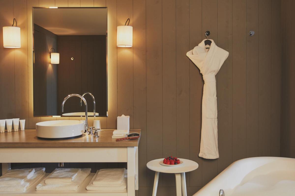 Un ou plusieurs lits dans un hébergement de l'établissement Hôtel Plage Palace & Spa