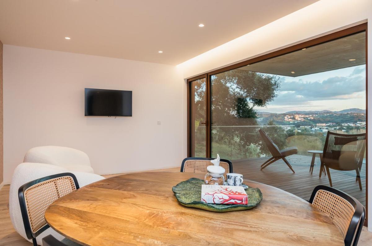 Uma televisão e/ou sistema de entretenimento em Haven Nature Hotel & Villas