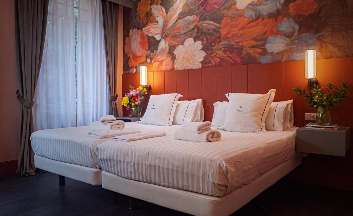 Cama o camas de una habitación en Hotel Balneario La Hermida