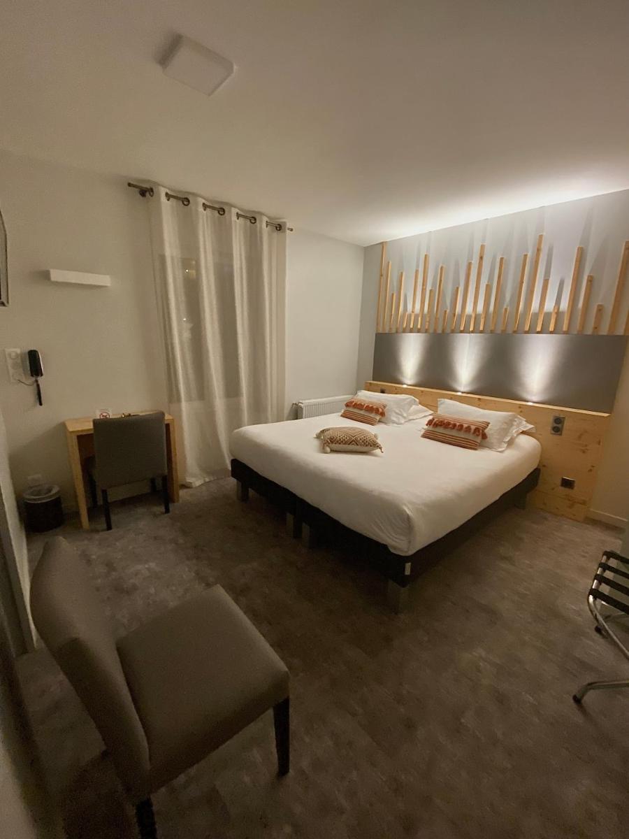 Un ou plusieurs lits dans un hébergement de l'établissement Le Castelet