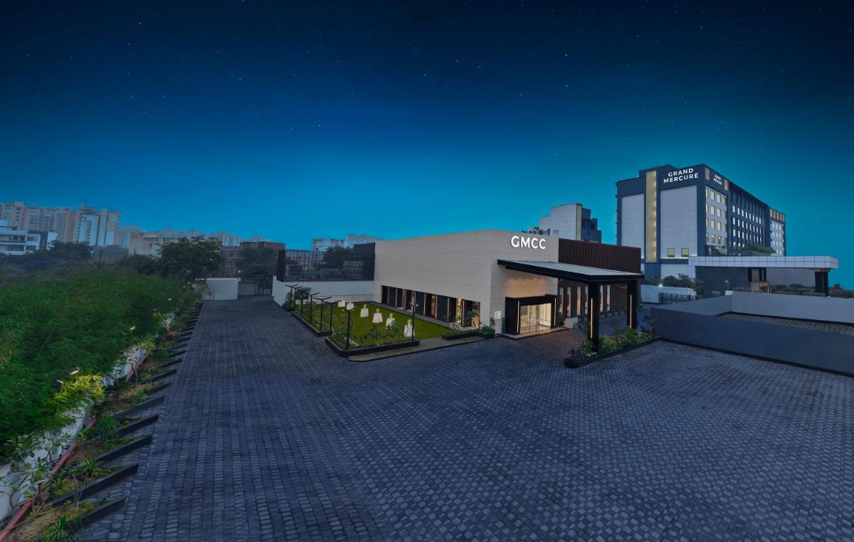 a building on top of a city at night at Grand Mercure Agra - An Accor Brand in Agra