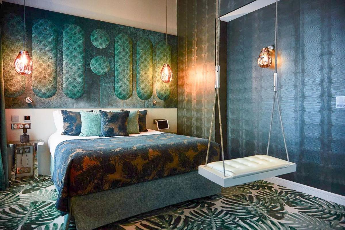 Un ou plusieurs lits dans un hébergement de l'établissement Paris j'Adore Hotel & Spa