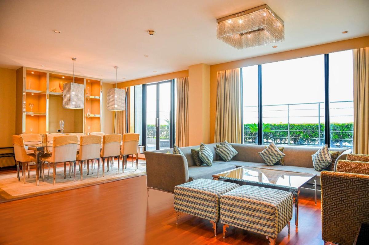 a living room with a couch and a table at Radisson Blu Hotel New Delhi Paschim Vihar in New Delhi a living room with a couch and a table at Radisson Blu Hotel New Delhi Paschim Vihar in New Delhi