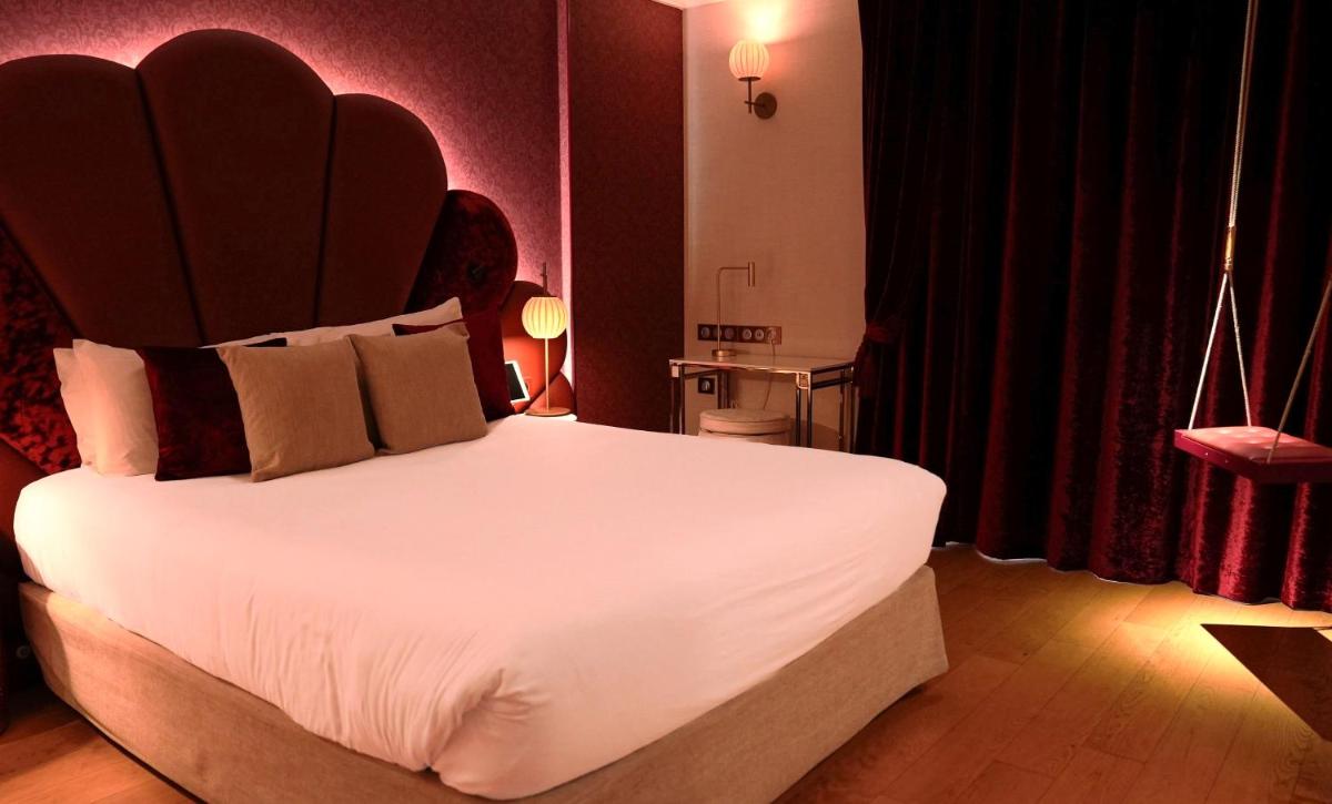 Un ou plusieurs lits dans un hébergement de l'établissement Paris j'Adore Hotel & Spa