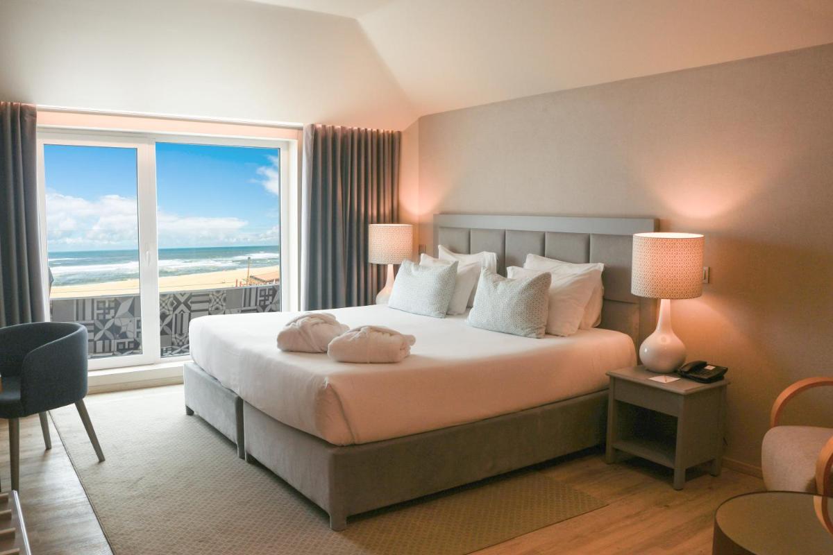 Uma cama ou camas num quarto em Hotel Cristal Vieira Praia & SPA