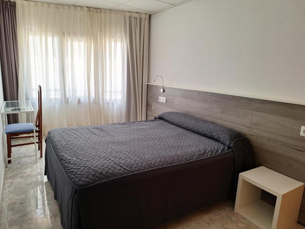 Cama o camas de una habitación en Hotel Xauen