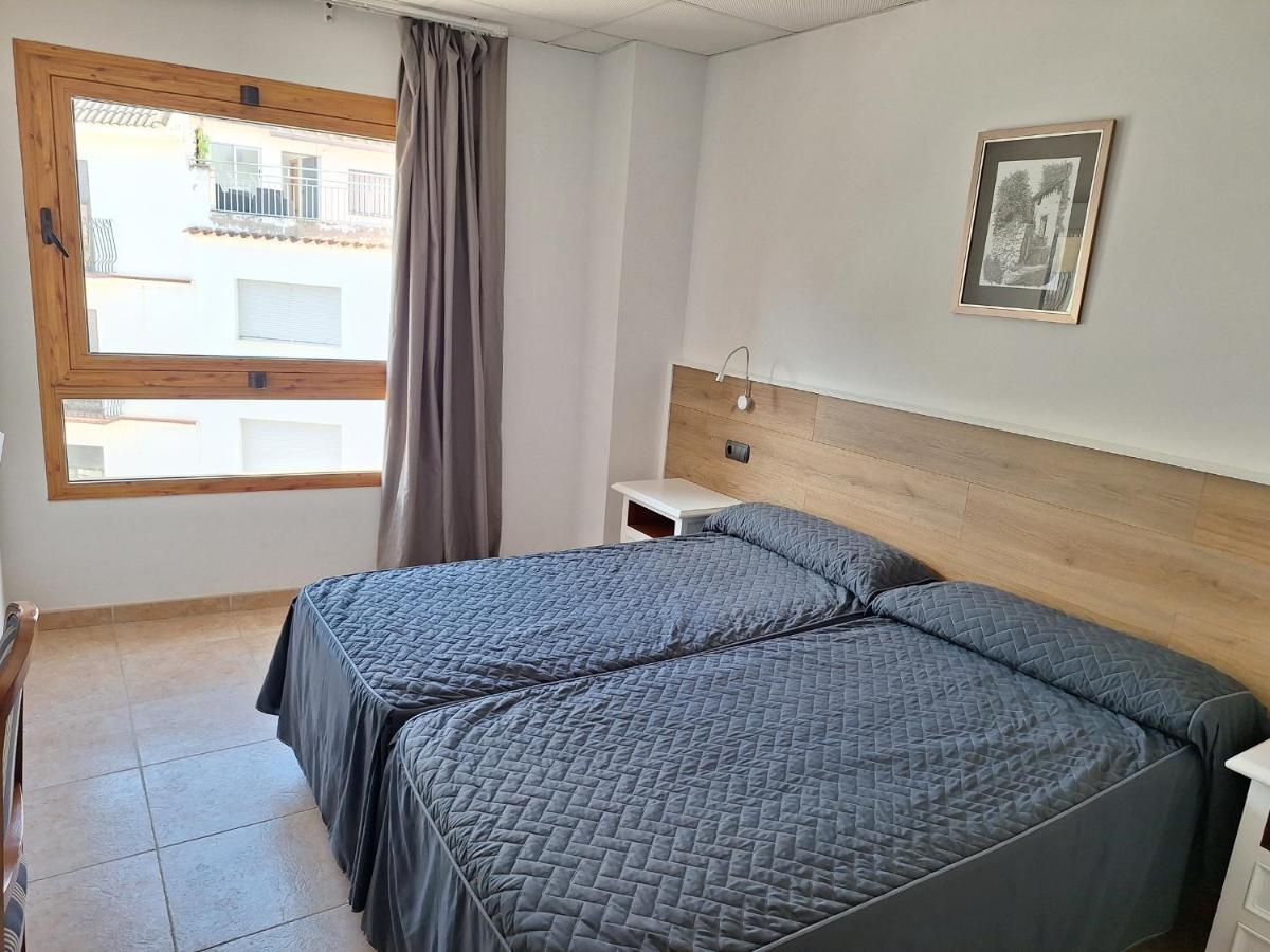 Cama o camas de una habitación en Hotel Xauen