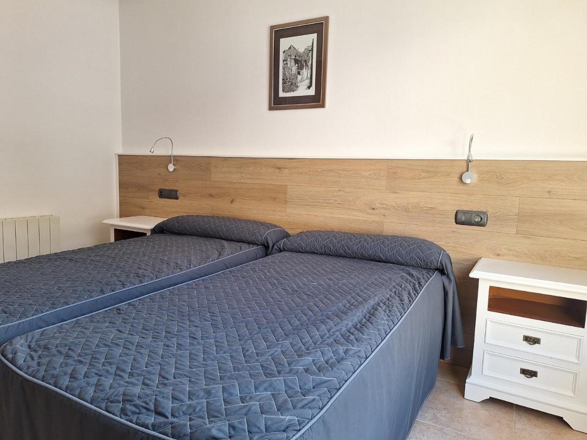 Cama o camas de una habitación en Hotel Xauen