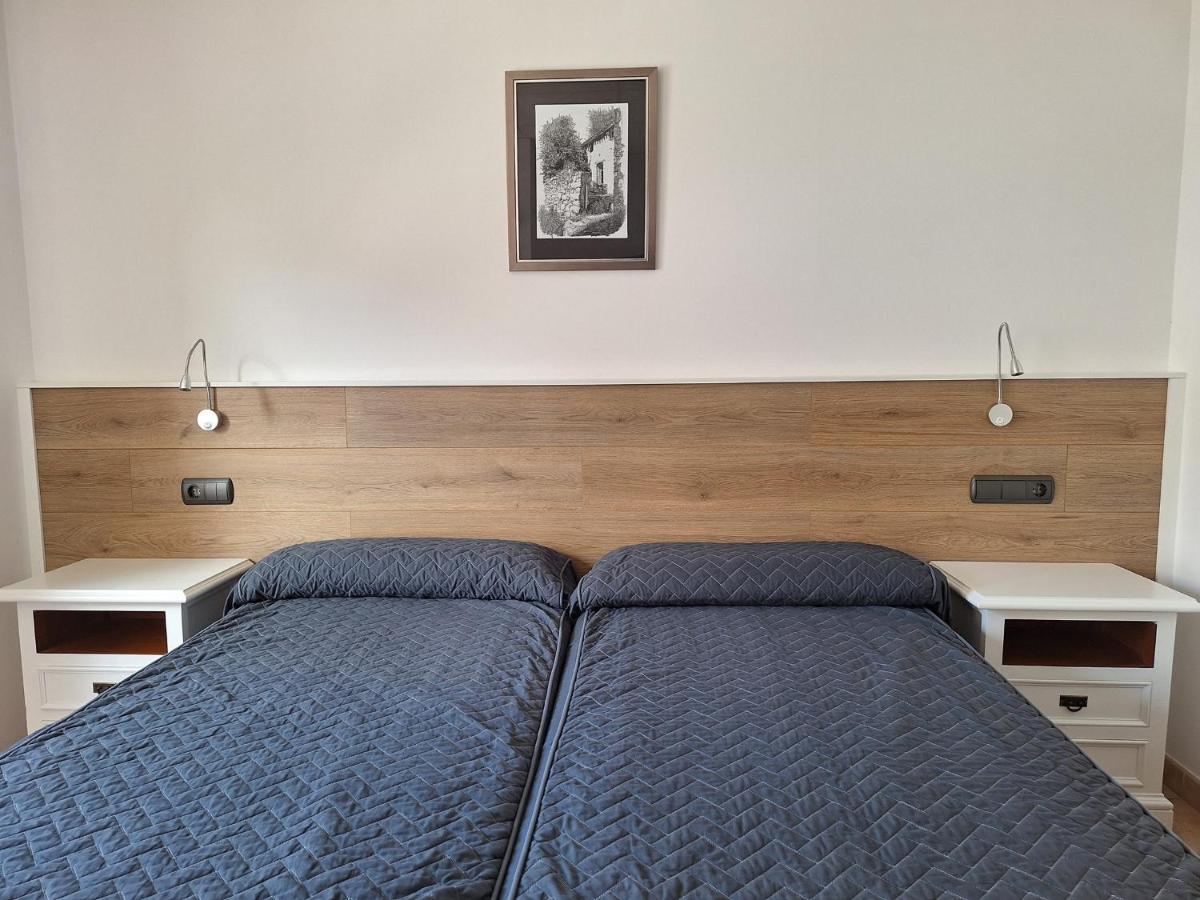 Cama o camas de una habitación en Hotel Xauen