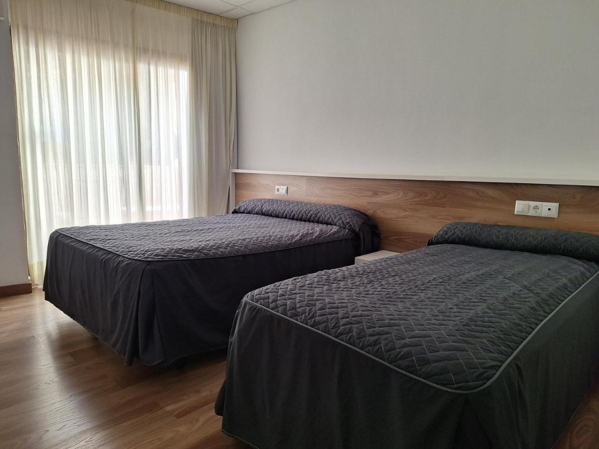 Cama o camas de una habitación en Hotel Xauen