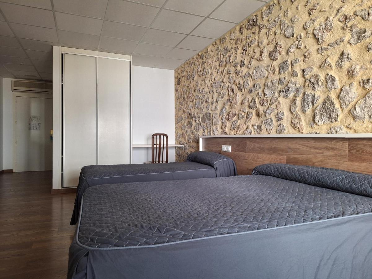 Cama o camas de una habitación en Hotel Xauen