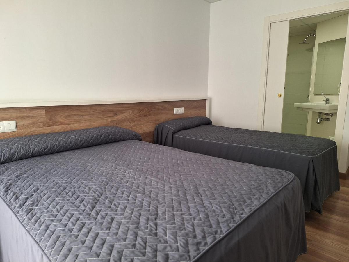 Cama o camas de una habitación en Hotel Xauen