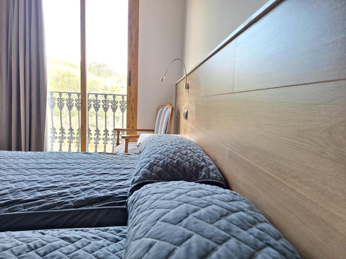 Cama o camas de una habitación en Hotel Xauen