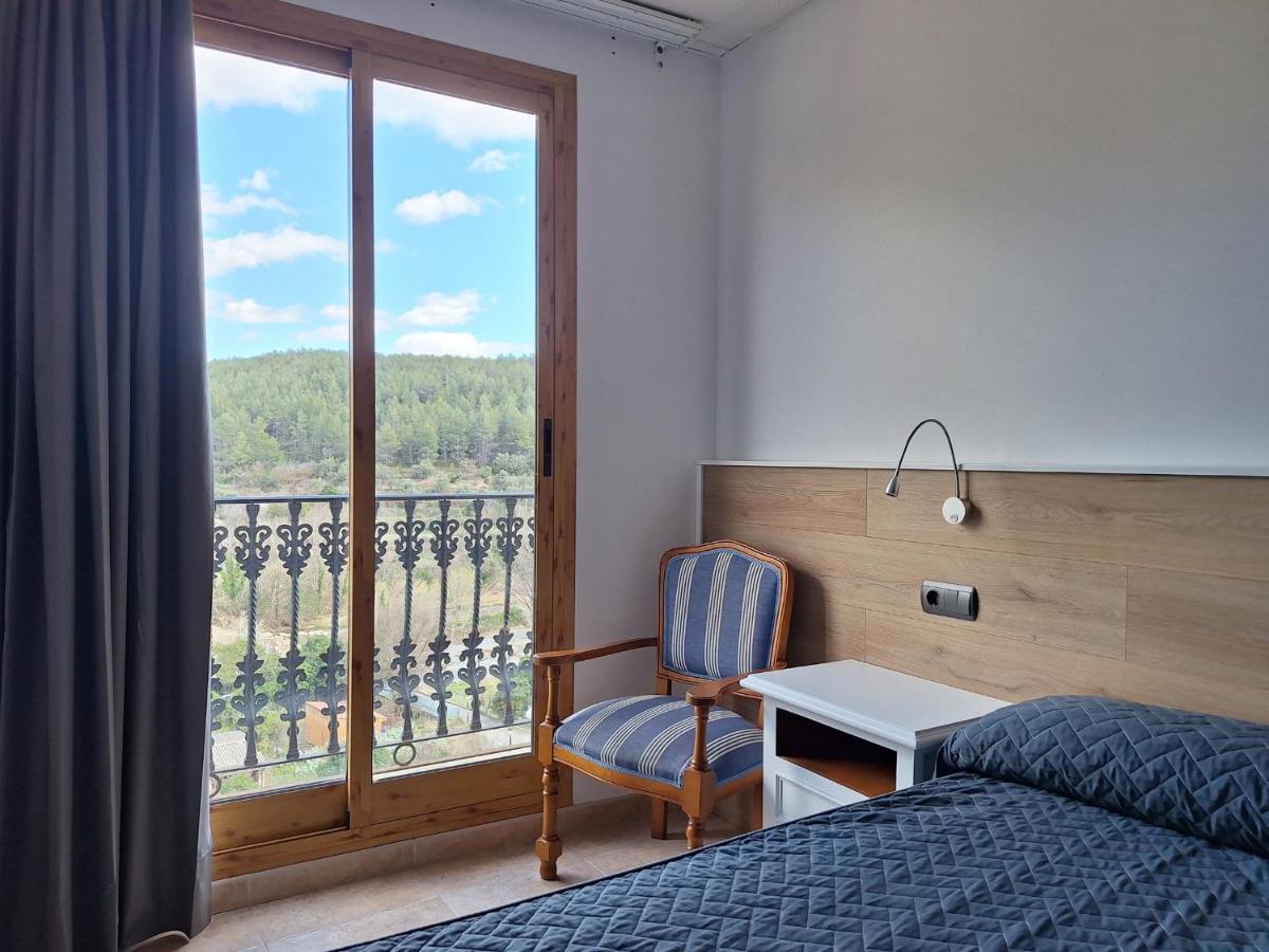 Cama o camas de una habitación en Hotel Xauen