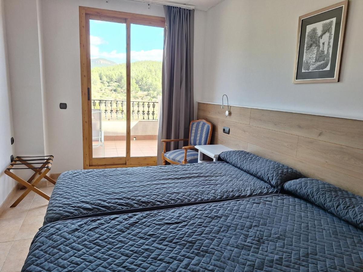 Cama o camas de una habitación en Hotel Xauen