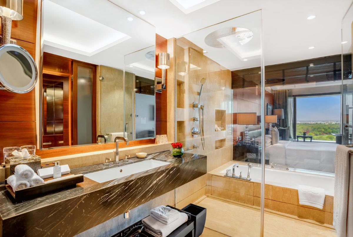 a bathroom with a sink and a shower at The Leela Ambience Gurugram Hotel & Residences - The Luxury Urban Sanctuary in Gurgaon
