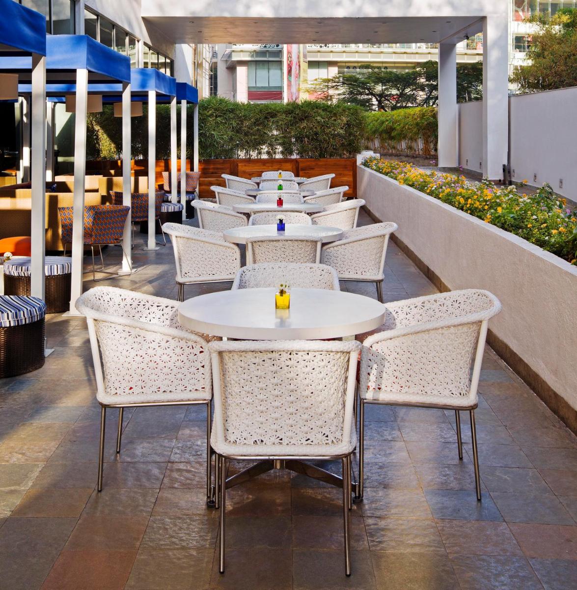 a row of tables and chairs on a patio at The Park Bangalore, MG Road in Bengaluru a row of tables and chairs on a patio at The Park Bangalore, MG Road in Bengaluru