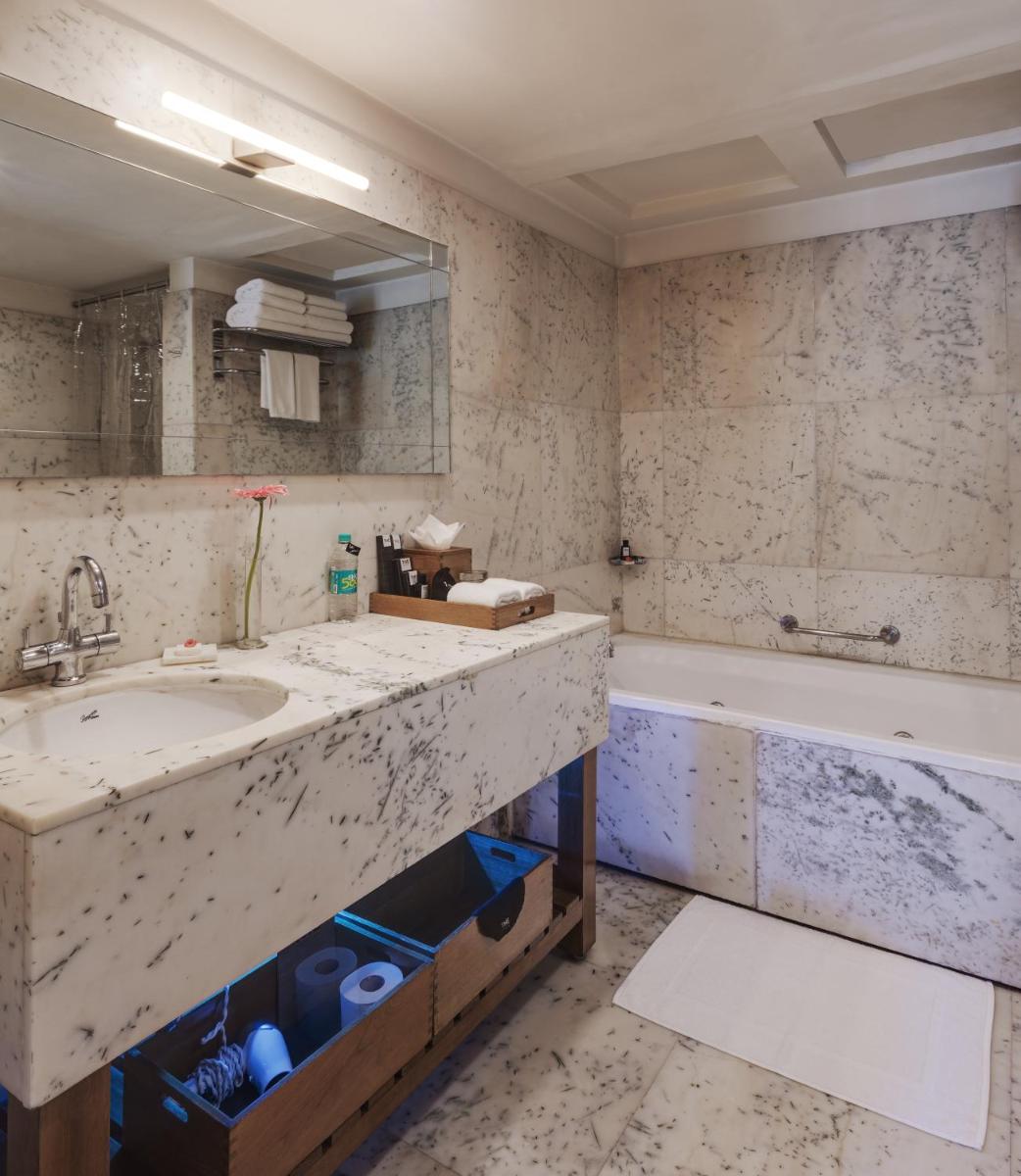 a bathroom with a sink and a bath tub at The Park Bangalore, MG Road in Bengaluru a bathroom with a sink and a bath tub at The Park Bangalore, MG Road in Bengaluru