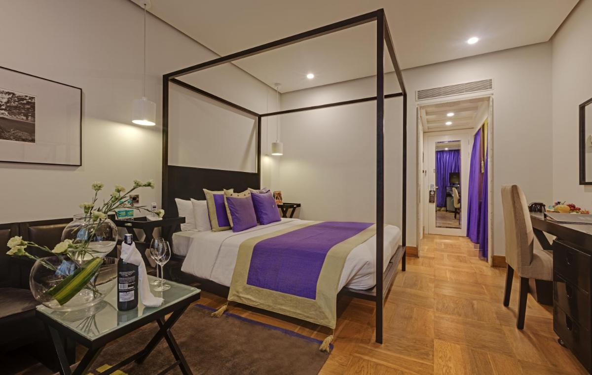 a hotel room with a bed and a table at The Park Bangalore, MG Road in Bengaluru a hotel room with a bed and a table at The Park Bangalore, MG Road in Bengaluru