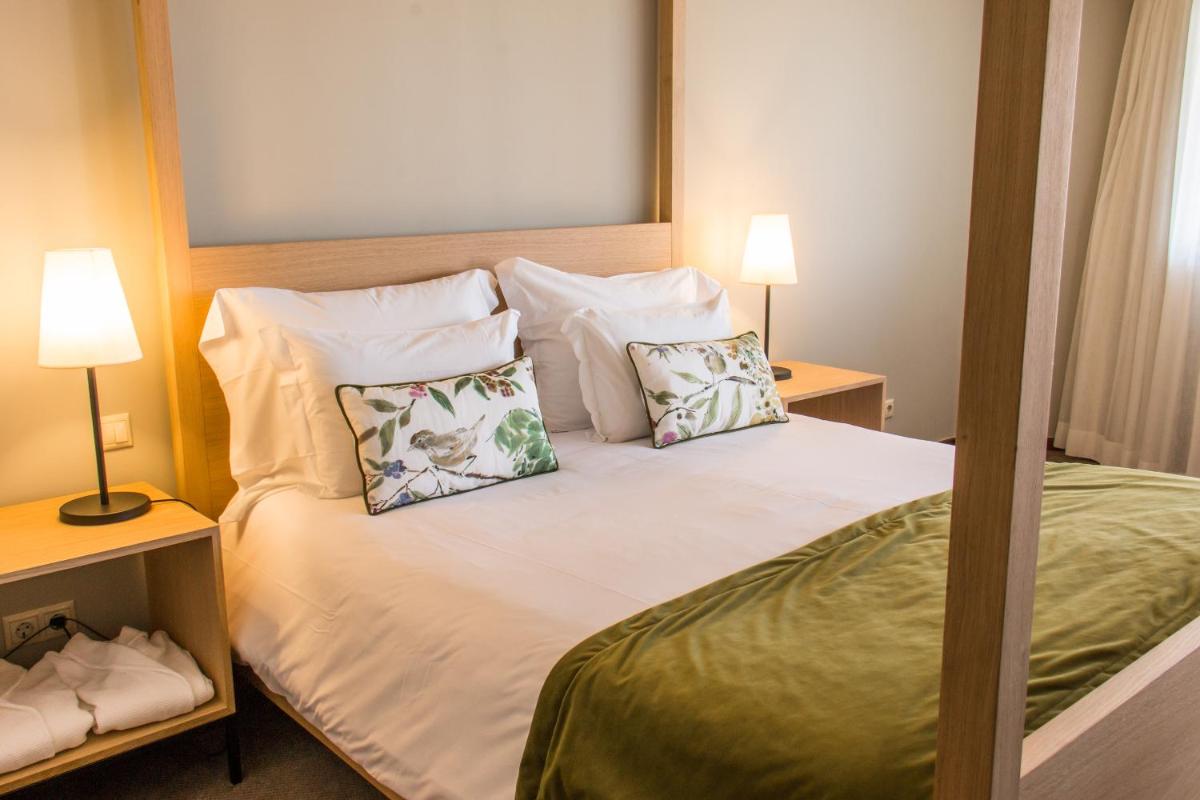 Uma cama ou camas num quarto em Evora Hotel