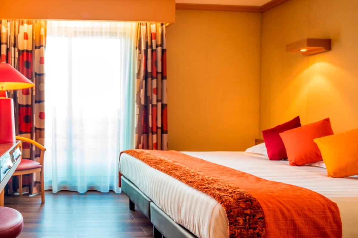 Un ou plusieurs lits dans un hébergement de l'établissement Hôtel Spa du Beryl St Brévin l'Océan