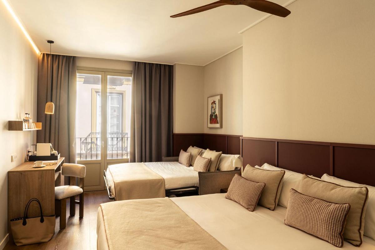 Cama o camas de una habitación en Hotel Well and Come Málaga