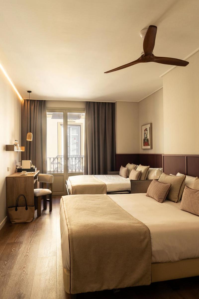 Cama o camas de una habitación en Hotel Well and Come Málaga