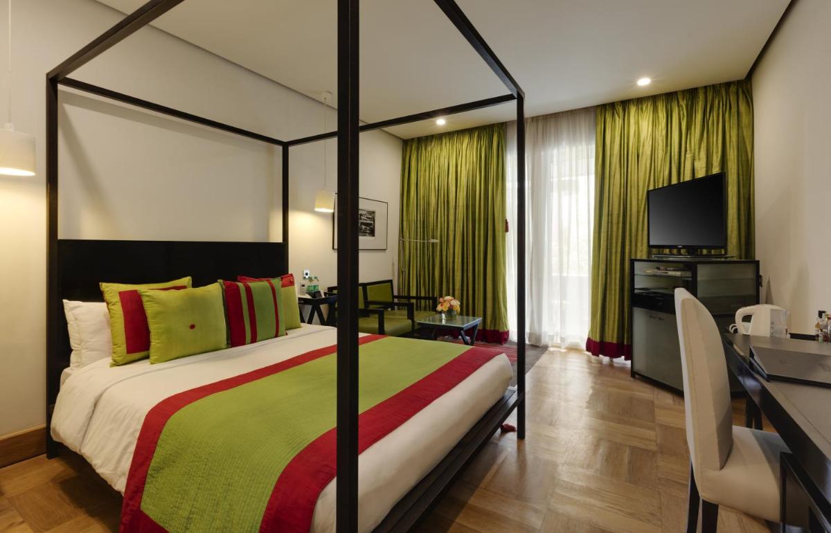 a bedroom with a large bed and a television at The Park Bangalore, MG Road in Bengaluru a bedroom with a large bed and a television at The Park Bangalore, MG Road in Bengaluru