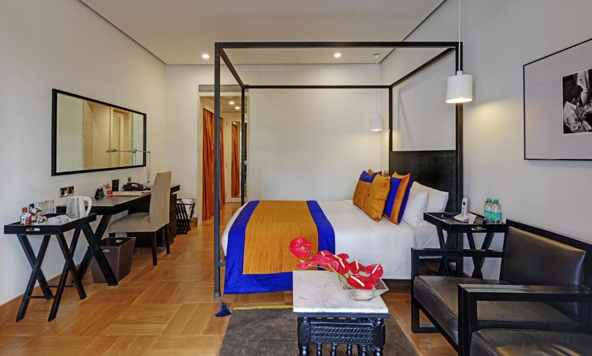a hotel room with a bed and a desk at The Park Bangalore, MG Road in Bengaluru a hotel room with a bed and a desk at The Park Bangalore, MG Road in Bengaluru