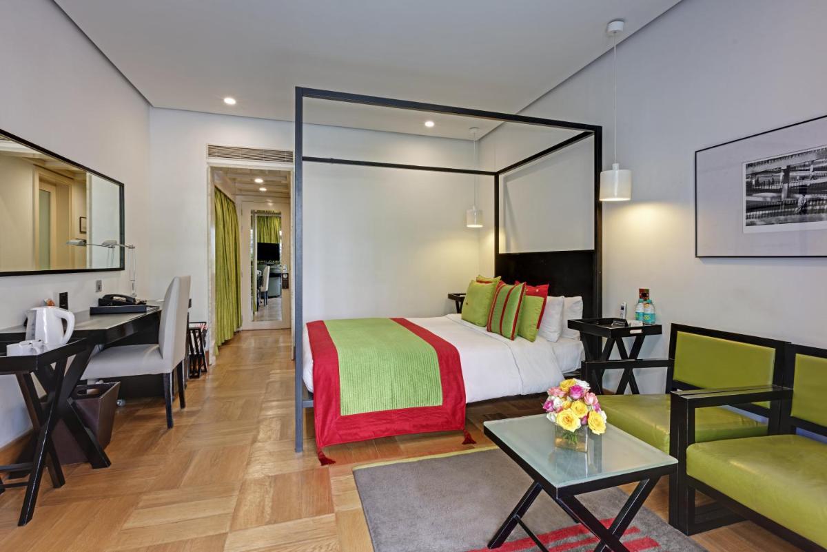 a hotel room with a bed and a desk at The Park Bangalore, MG Road in Bengaluru a hotel room with a bed and a desk at The Park Bangalore, MG Road in Bengaluru