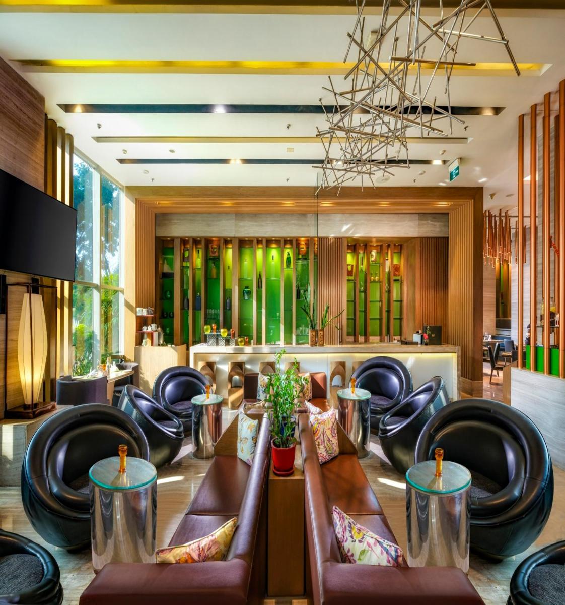 a lobby with chairs and a table in a room at Welcomhotel by ITC Hotels, Richmond Road, Bengaluru in Bengaluru