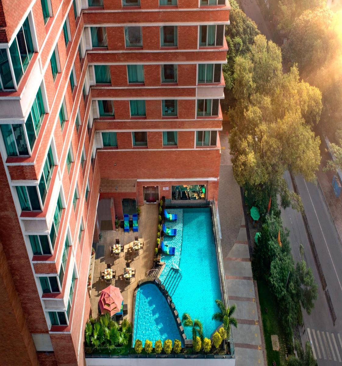 an aerial view of a hotel with a swimming pool at Welcomhotel by ITC Hotels, Richmond Road, Bengaluru in Bengaluru
